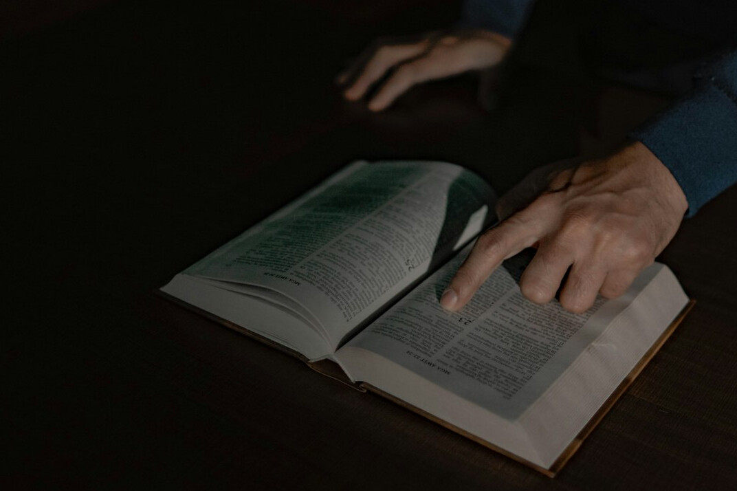 person examining old book
